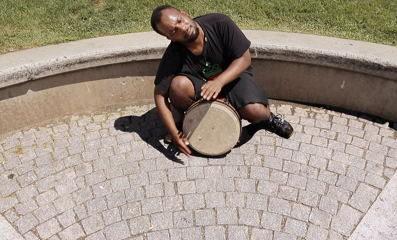 Said Anwar Cato-King plays his djembe at Bell Buoy Park on Commercial Street on July 30.