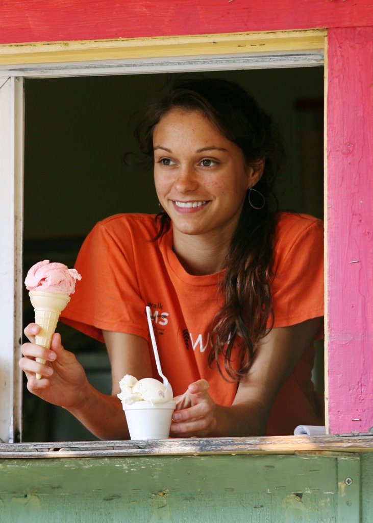 Madeline Miele serves up ice cream Friday at Kettle Cove Creamery.