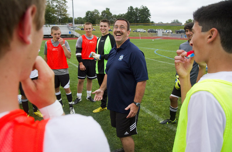 Wally LeBlanc shares a laugh with his new team before a recent scrimmage. LeBlanc started his coaching career with Windham in 1993, and now he’s back.