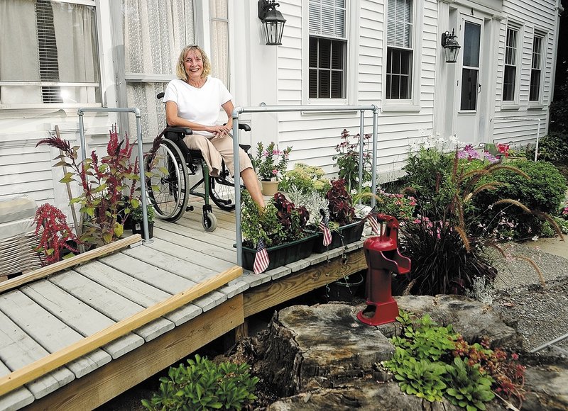 Ann Lindholm is shown at her Winthrop home. She says that in order to emerge from the pain of facing an amputation, “You can’t make it through without becoming stronger in all ways.”