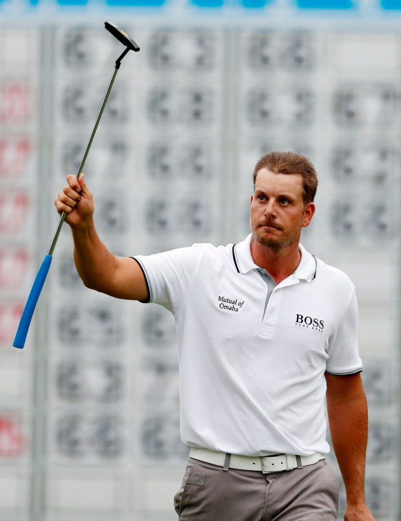 Henrik Stenson salutes the gallery on the 18th hole after winning the Deutsche Bank Championship at Norton, Mass., on Monday. Stenson tied the tournament record by shooting a 22-under 262.