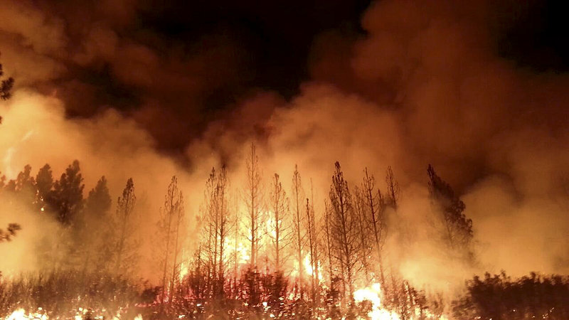 The Rim Fire, shown in a photo from the U.S. Fire Service, burns near Yosemite National Park. Scientists predict it will burn until autumn storms arrive.
