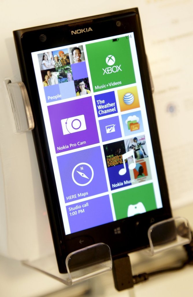 A Nokia phone runs Windows software, which could be a more common sight after Microsoft’s $7.2 billion acquisition of the Finnish cellphone company.