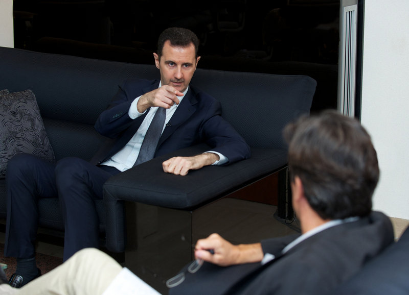 Syrian President Bashar Assad gestures during an interview with the French daily newspaper Le Figaro on Monday.