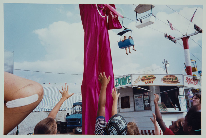 From “Mentor,” “Stilt Man, Ohio State Fair,” 1985, by Renee Psiakis.
