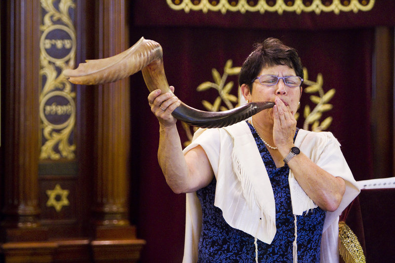 With the Jewish holiday of Rosh Hashanah beginning Wednesday, Rabbi Carolyn Braun plays a Shofar, (a horn-like instrument made from a bovine horn) part of a 30-minute ceremony at The Cedars retirement community in Portland on Wednesday, Sept. 4, 2013.