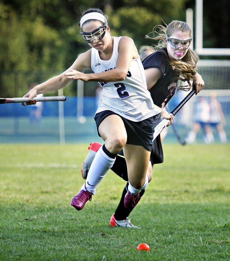 Abby Doyle of Marshwood races for the ball ahead of Maggie Carbin of Scarborough during Scarborough’s 2-1 field hockey victory Wednesday.