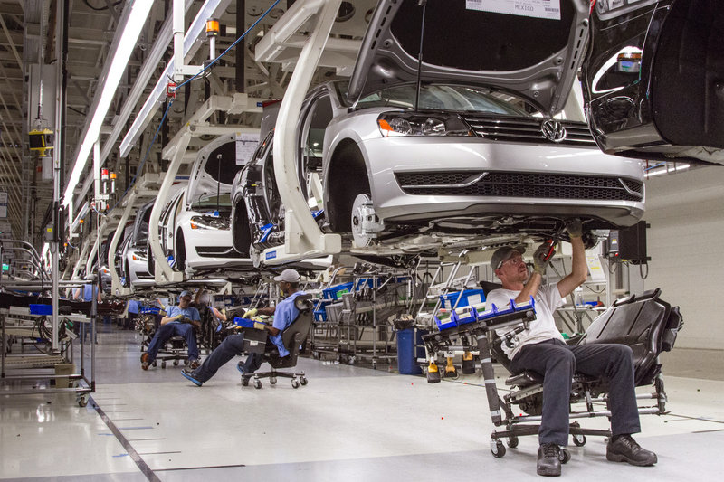 Employees work on the Passat sedan assembly line at the VW plant in Chattanooga, Tenn. Volkswagen faces pressure from labor interests to grant workers a stronger voice at the plant.