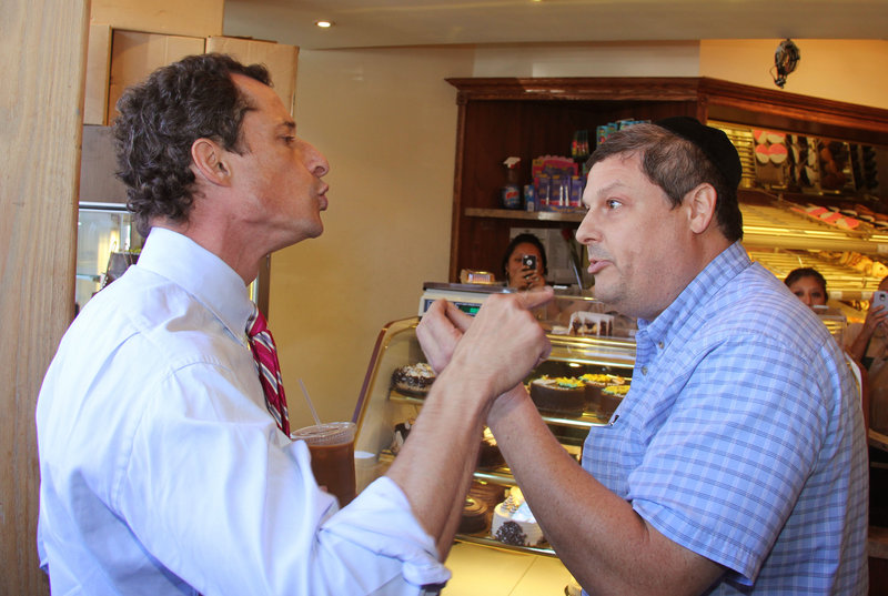 Anthony Weiner and a heckler don’t shy from pointing fingers Wednesday in a Brooklyn bakery.