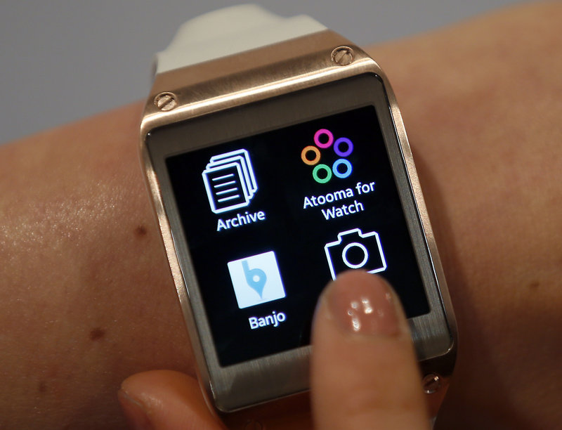 A Samsung Galaxy Gear digital watch works through a wireless link with the user’s smartphone.