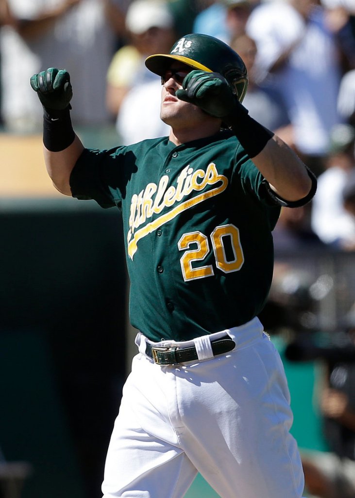 Oakland’s Josh Donaldson circles the bases after his three-run homer in the sixth inning of an 11-4 win by the Athletics over the visiting Texas Rangers on Wednesday.