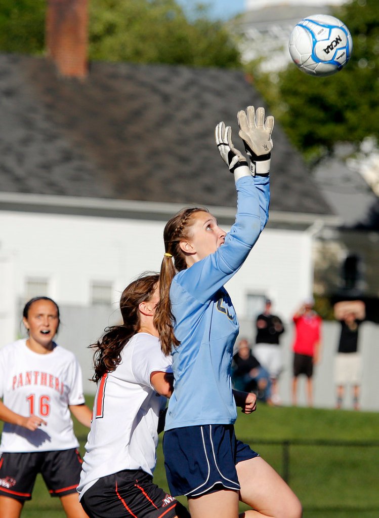 Traip Academy keeper Lynn Moore makes a save off a corner kick against North Yarmouth Academy.