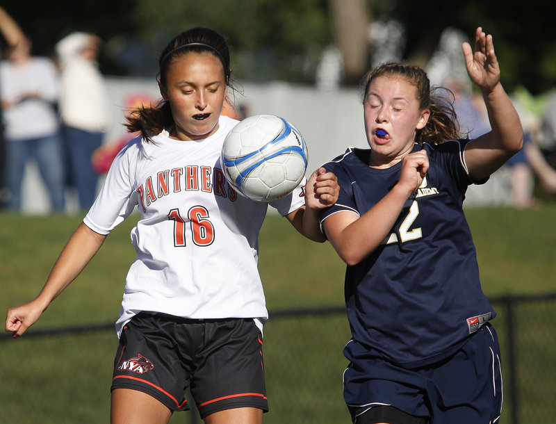 Chloe Leishman, left, of North Yarmouth Academy battles for control of the ball with Sarah Montembeau of Traip Academy during a Western Maine Conference season opener Friday. Leishman scored NYA’s first goal in a 2-0 win.