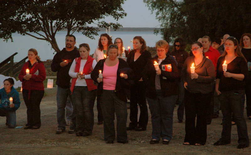 A vigil is held Friday at Belfast City Park for Lynn Arsenault, who was fatally shot Aug. 28 in her Belfast home. Todd Gilday of Belfast has been charged in the attack that also wounded Arsenault’s youngest son.