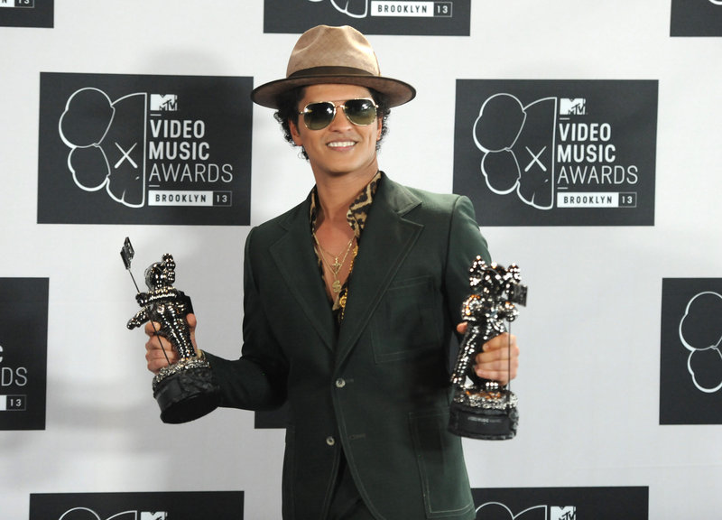 Bruno Mars will sing at the Super Bowl, a source says. His latest top hit is “When I Was Your Man.”