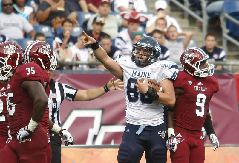 Maine tight end Justin Perillo celebrates a catch that set up a third-quarter touchdown Saturday at Gillette Stadium as the Black Bears knocked off Massachusetts, 24-14.