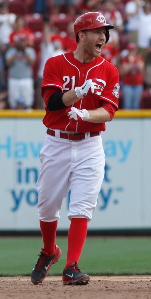 Cincinnati’s Todd Frazier celebrates after hitting the game-winning single to drive home Billy Hamilton in the Reds’ 4-3 win over the Dodgers at Cincinnati on Saturday.