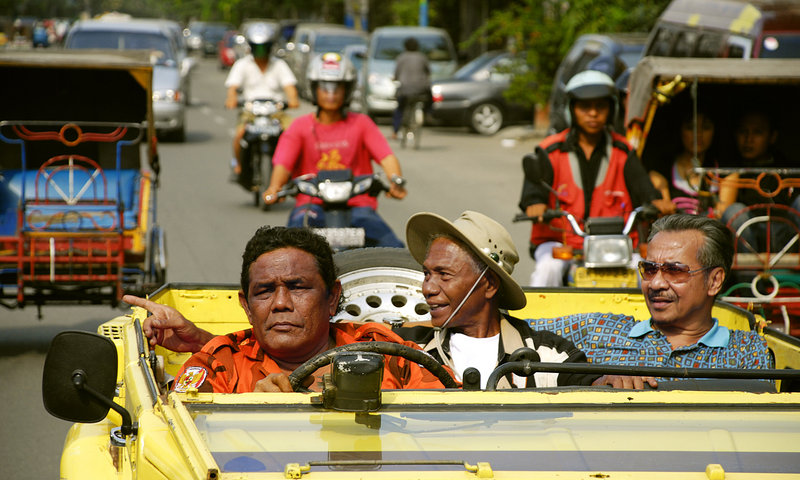 From left, Safit Pardede, Anwar Congo and Adi Zulkadry in a scene from “The Act of Killing.”