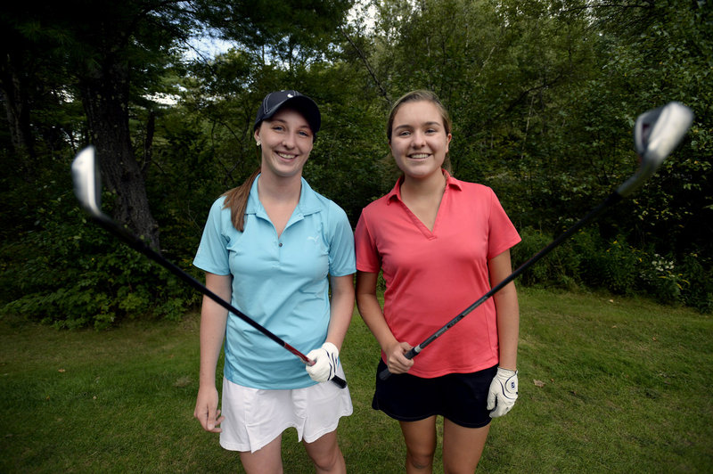Seniors Monica Austin, left, and Grace King are among Yarmouth High School’s top golfers, and at ease playing with and against boys.