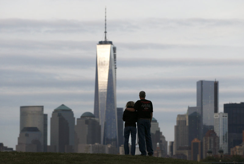 A couple looks at New York’s Lower Manhattan and One World Trade Center from Liberty State Park in Jersey City, N.J. on Monday. New York will mark the 12th anniversary of the Sept. 11 attack on the World Trade Center on Wednesday.