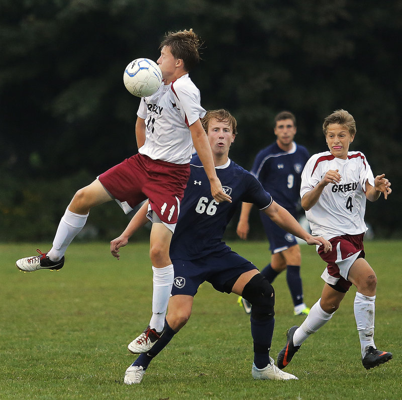 Aidan Black of Greely looks to chest the ball down in front of Wyatt Jackson of Yarmouth during their 2-2 tie at Cumberland in a Western Class B game Tuesday.