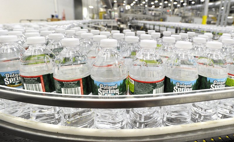 Bottles of water line the conveyor belt at Poland Spring’s Hollis plant. Those who say the company is depleting southern Maine’s water supply are misinformed, a reader says.