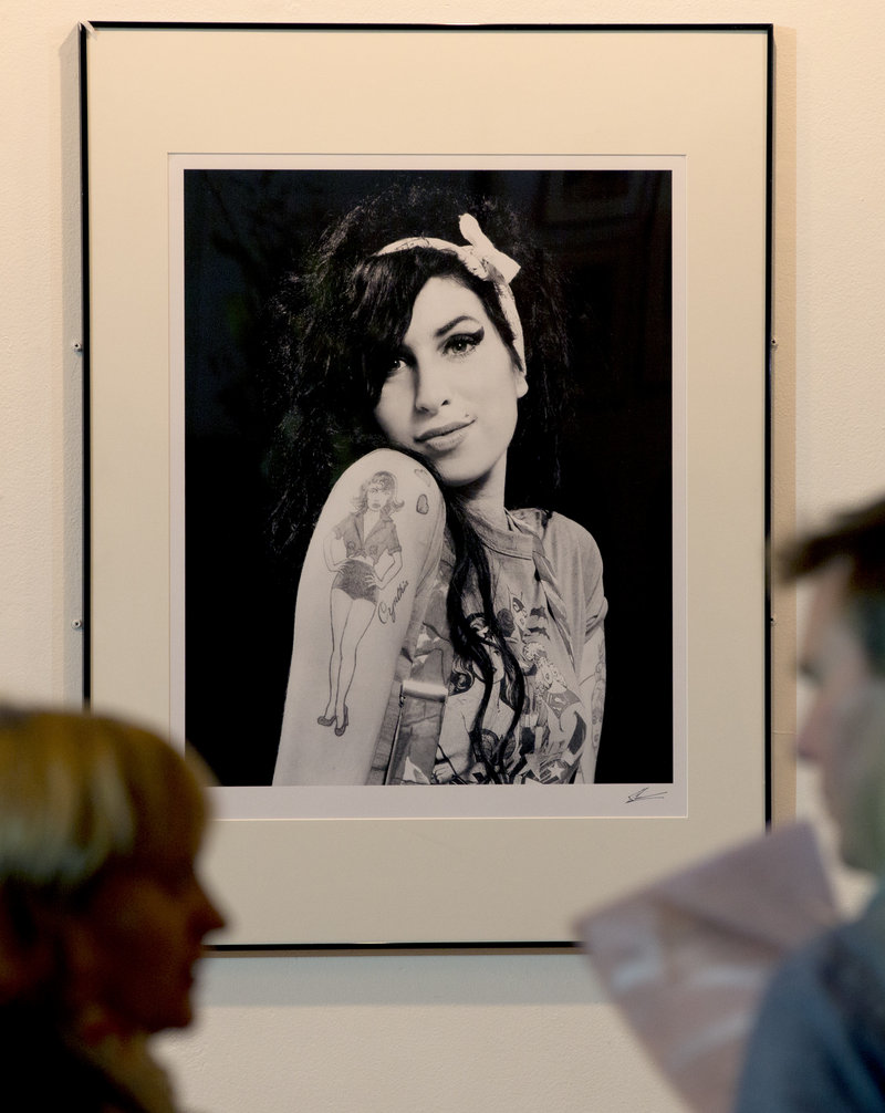 A portrait of British singer Amy Winehouse, who died in 2011 at age 27, hangs in the Proud gallery in Camden, London.