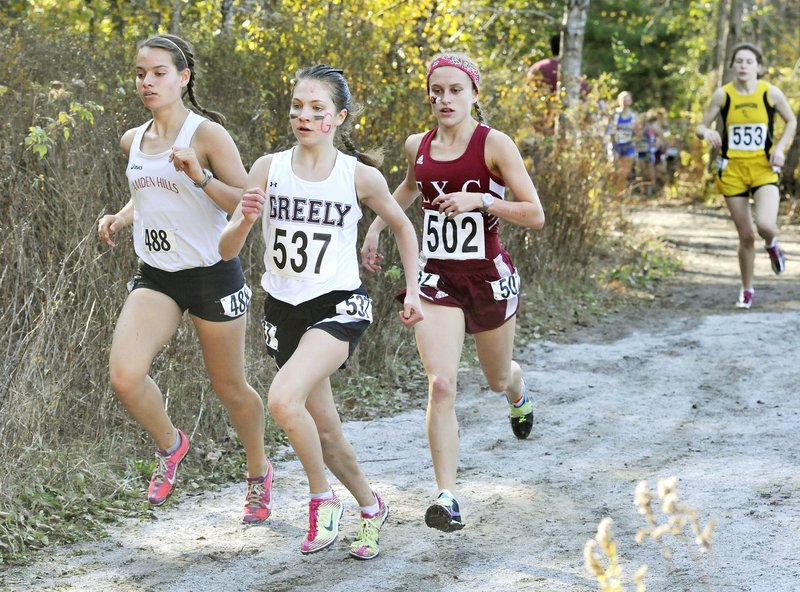 Kirstin Sandreuter of Greely, center, and Brittany Bowman of Camden Hills, left, will be close again this year while competing for the Class B title.