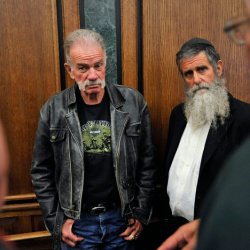 Gainesville Florida pastor Terry Jones and Rabbi Nachum Shifren of Santa Monica, California chat with two other men during a brief recess in the 19th District Dearborn Court