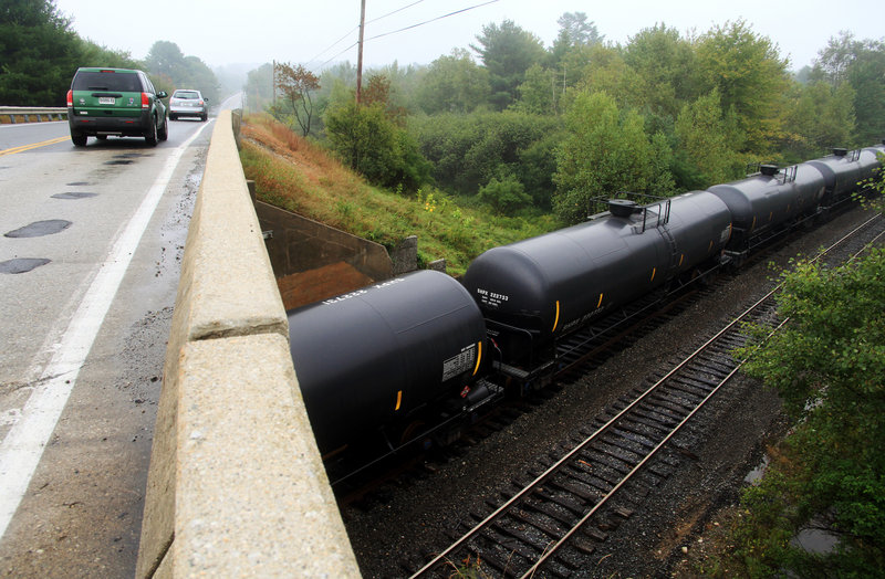 Oil-tank rail cars sit idle and empty near Route 115 in Yarmouth, Maine on July 18, 2013.