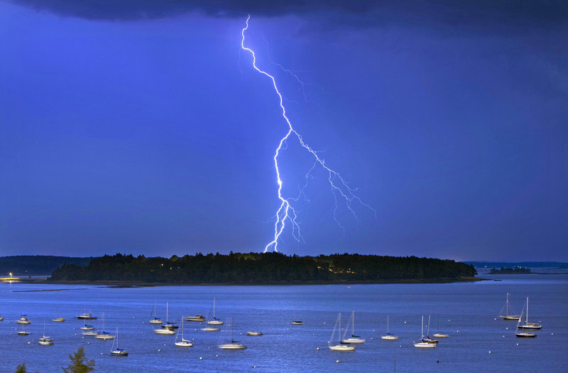 Lightning strikes north of Falmouth’s Mackworth Island Wednesday. Weather officials said there were more than 1,000 lightning strikes per hour at the storm’s height.