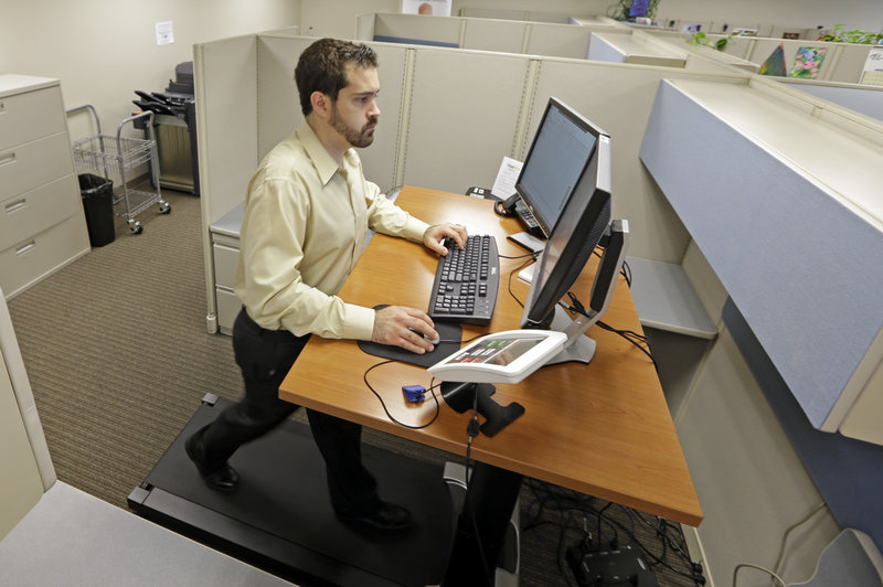 Josh Baldonado, an administrative assistant at Brown & Brown, an insurance consulting firm in Carmel, Ind., works at a treadmill desk. Treadmill desks designed for the workplace are normally set to move at 1 to 2 mph, enough to get the heart rate up.