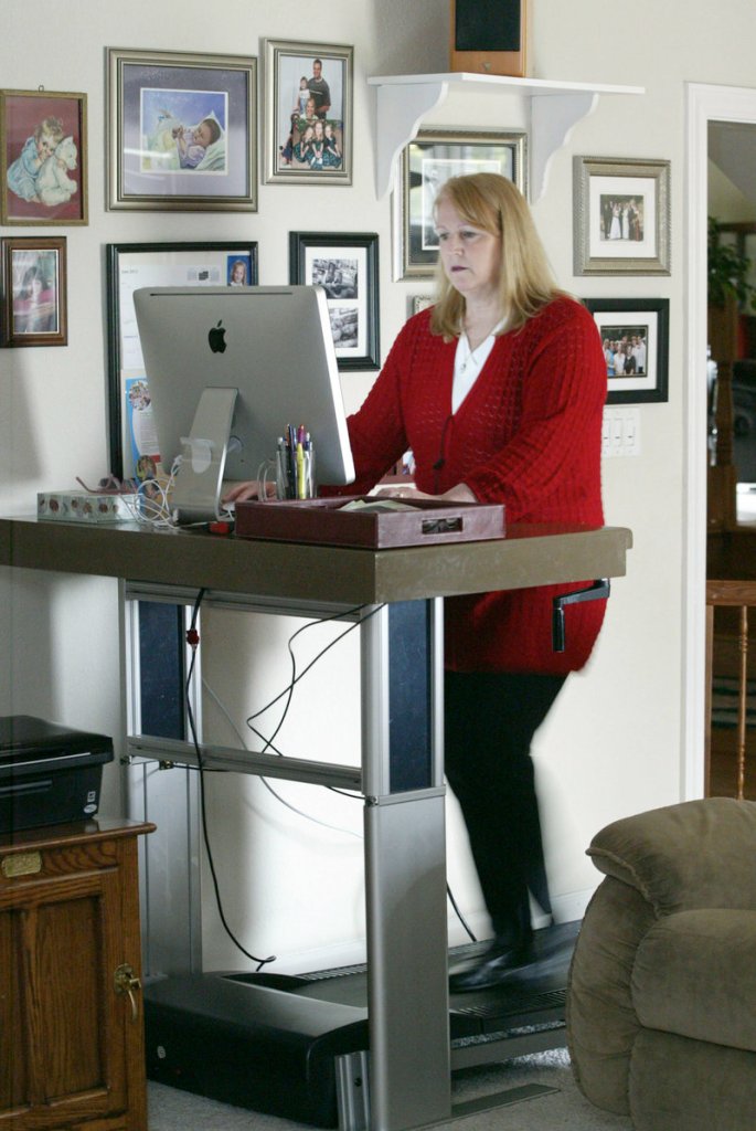 Mary Gagnon uses a treadmill desk at her home in Danville, Calif.