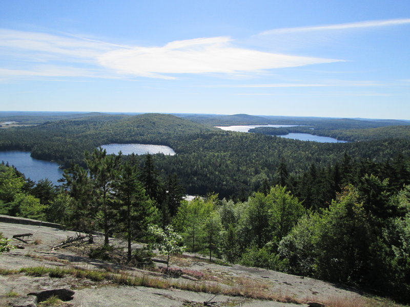 Hikers who opt to continue to Tunk Mountain’s summit ridge will be treated to the kind of scenic vista that’s rare outside of Maine’s largely unspoiled north country. Recent amenities make the trek up the 1,157-foot mountain easier.