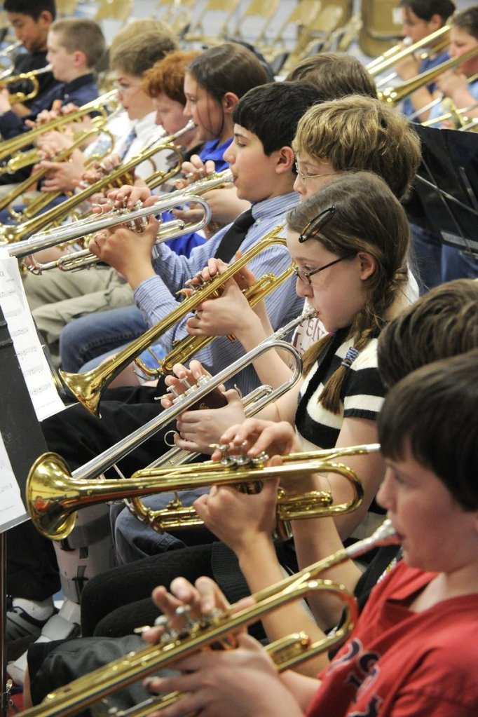 Band students from 40 schools rehearse for the District II Elementary Music Festival at Riverton Middle School in Portland in 2010. Handing a child a smartphone at a school concert or other performance distracts fellow audience members and is discourteous to those on stage.