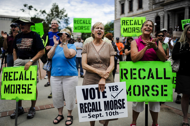 Supporters of the recall election to oust Colorado Senate President John Morse rally outside the Pioneer Museum in Colorado Springs, Colo., on Sept. 4.