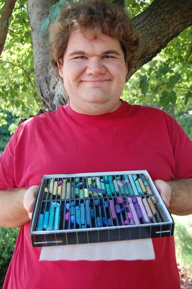 Dallas Looman, 25, displays the pastels that he enjoys using.