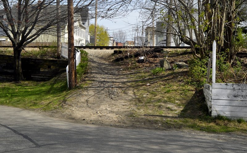 A man was killed by an Amtrak passenger train in April 2012 near this pedestrian cut-through from West Cutts Street to Cutts Street in Biddeford. Since 2003, trespassing on rail lines in Maine has led to 10 deaths and five serious injuries.