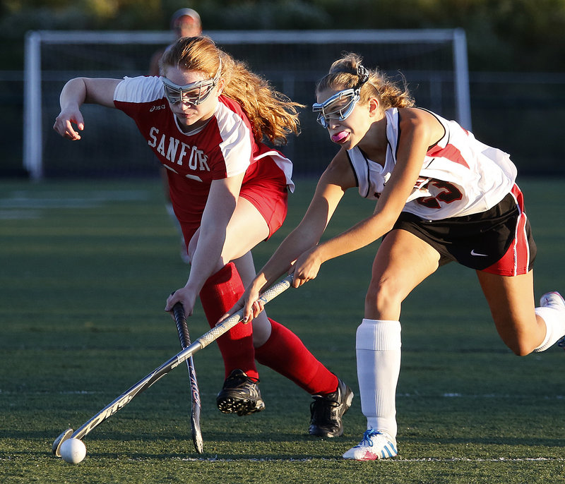 Scarborough junior Gabby Farino, right, keeps control of the ball despite the best efforts of Sanford’s Allison L’Heureux during Monday’s game in Scarborough, won by the Red Storm in typical convincing fashion, 6-0.