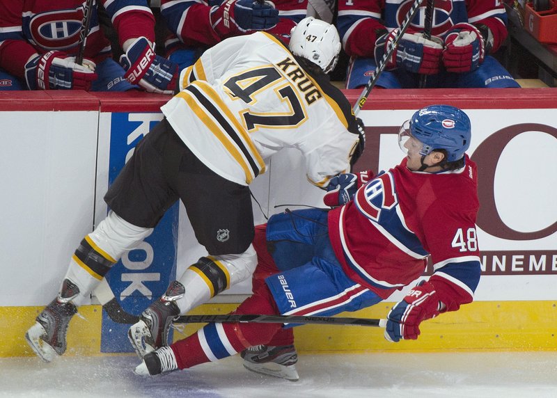 Montreal’s Daniel Briere is knocked to the ice by Boston’s Torey Krug during the first period of Monday’s preseason game in Montreal, won by the Bruins.
