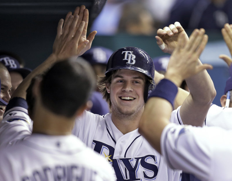 Tampa Bay’s Wil Myers is glad-handed after his second-inning homer during a 6-2 Rays win at St. Petersburg, Fla., on Monday.
