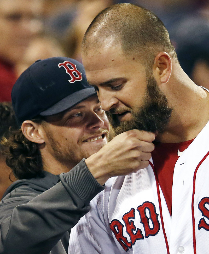 Beard-pulling is a new tradition in Boston, as Mike Napoli gets his pulled by Clay Buchholz after Napoli’s homer on Wednesday.