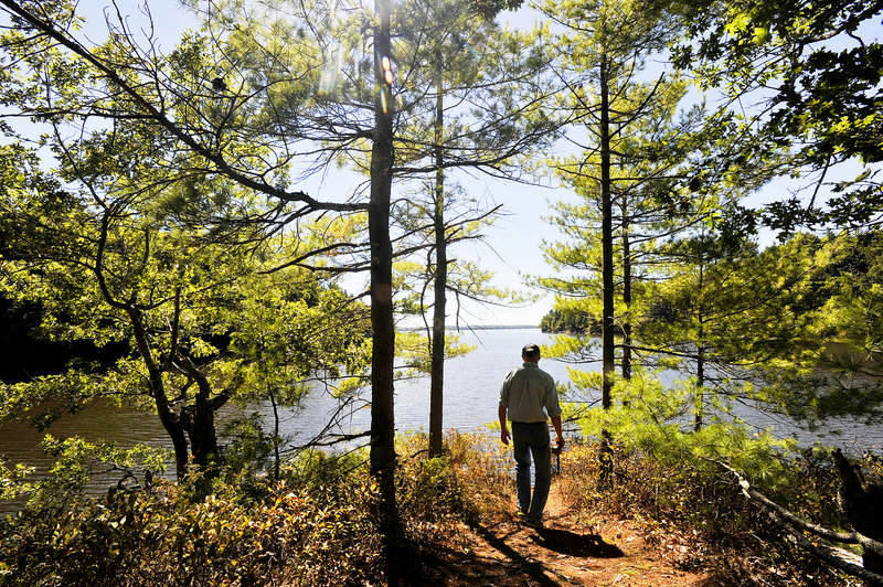 The path to a scenic overlook on the Back River in Wiscasset is an ideal example of the offerings of the Great Maine Outdoor Weekend. Henry Heyburn, assistant director of the Chewonki Camp for Boys, soaks in the view.