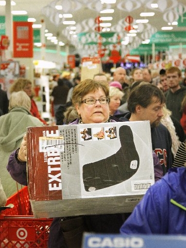 A Black Friday shopper is shown at Target in South Portland. Target plans to hire fewer seasonal workers.