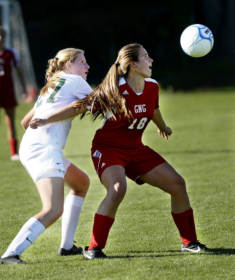 Maria Valente of Gray-New Gloucester tries to shield Waynflete’s Marijke Rowse away from the ball during their Western Maine Conference girls’ soccer game Friday in Portland. Waynflete won, 3-0.