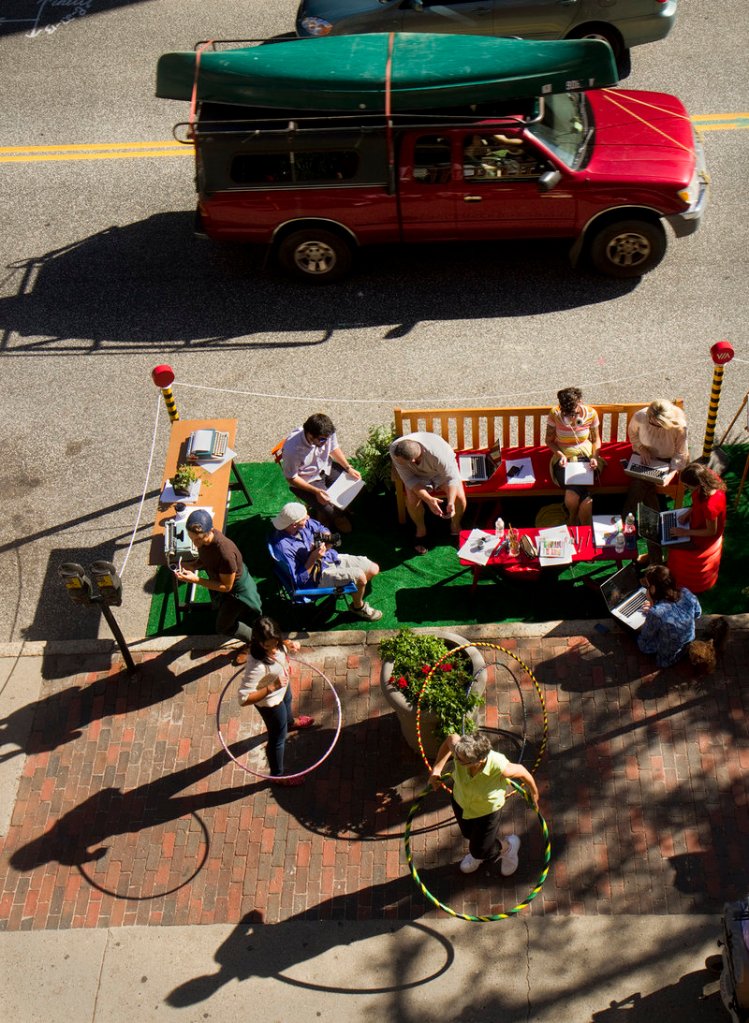 Employees and friends of The Via Agency on Congress Street participate in Portland's second annual Park(ing) Day on Friday, Sept. 20, 2013. Taking place in nearly 200 cities around the world, people take over parking spaces for to hang out and have fun.