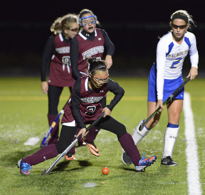 Lee Brown of Freeport passes the ball in front of Falmouth’s Jillian Rothweiler. Falmouth recorded its sixth shutout in seven games this season.