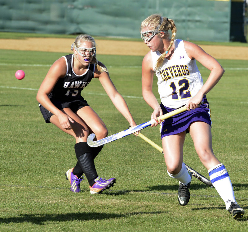 MaryKate Slattery of Cheverus watches the field hockey ball Tuesday while covered by Ashley Hickey of Marshwood during their SMAA game at Cheverus High. Cheverus won 1-0 to improve to 6-1. Marshwood dropped to 6-2.