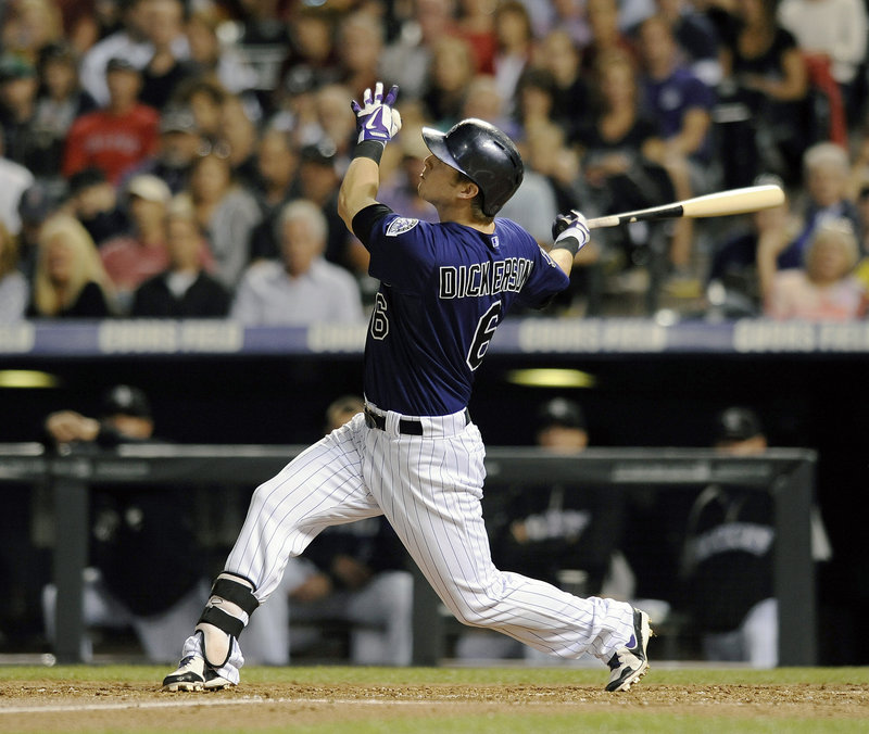 Corey Dickerson of the Colorado Rockies connects for a solo homer off John Lackey in the fourth inning Tuesday night during an 8-3 victory against the Boston Red Sox.