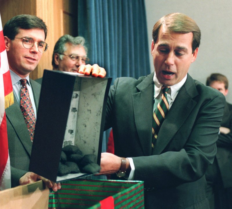In 1995, Rep. John Boehner, R-Ohio, opens a box of coal, which he said would be a Christmas gift for President Clinton. At the time, Republicans in Congress were engaged in a standoff with Democrats over the budget that had led to a six-day partial shutdown. Democrats are hoping the current, similar standoff will help them at the polls.